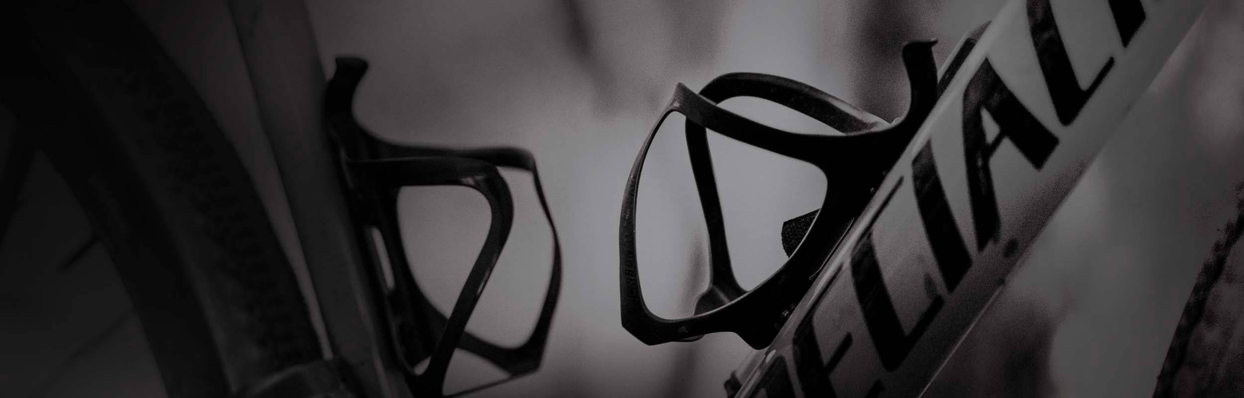 2 bottle cages mounted to a bicycle frame.