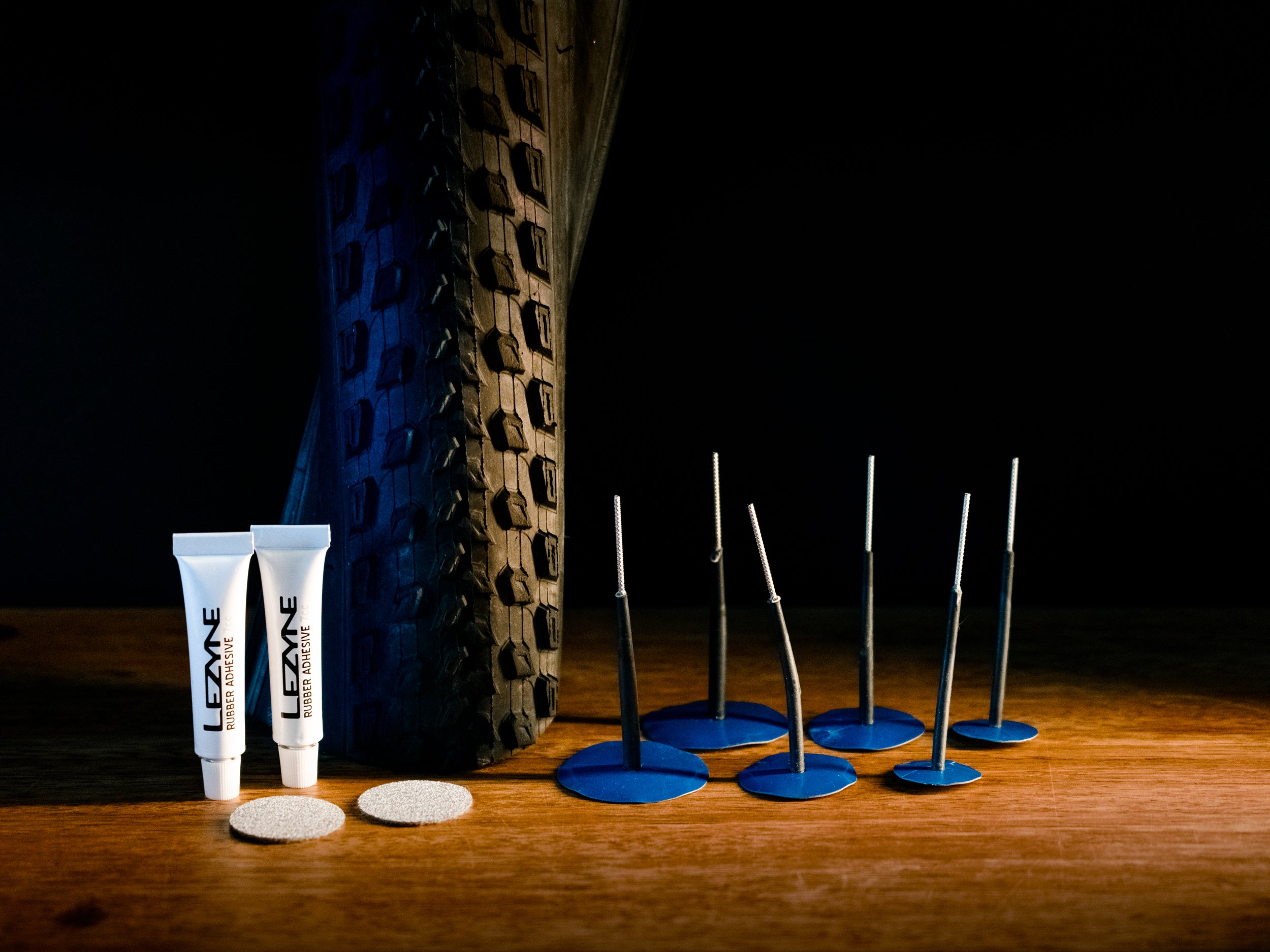 A pack of Lezyne Tubeless Pro Plugs with multiple sizes for different puncture needs. Abrasive pad and rubber cement included.