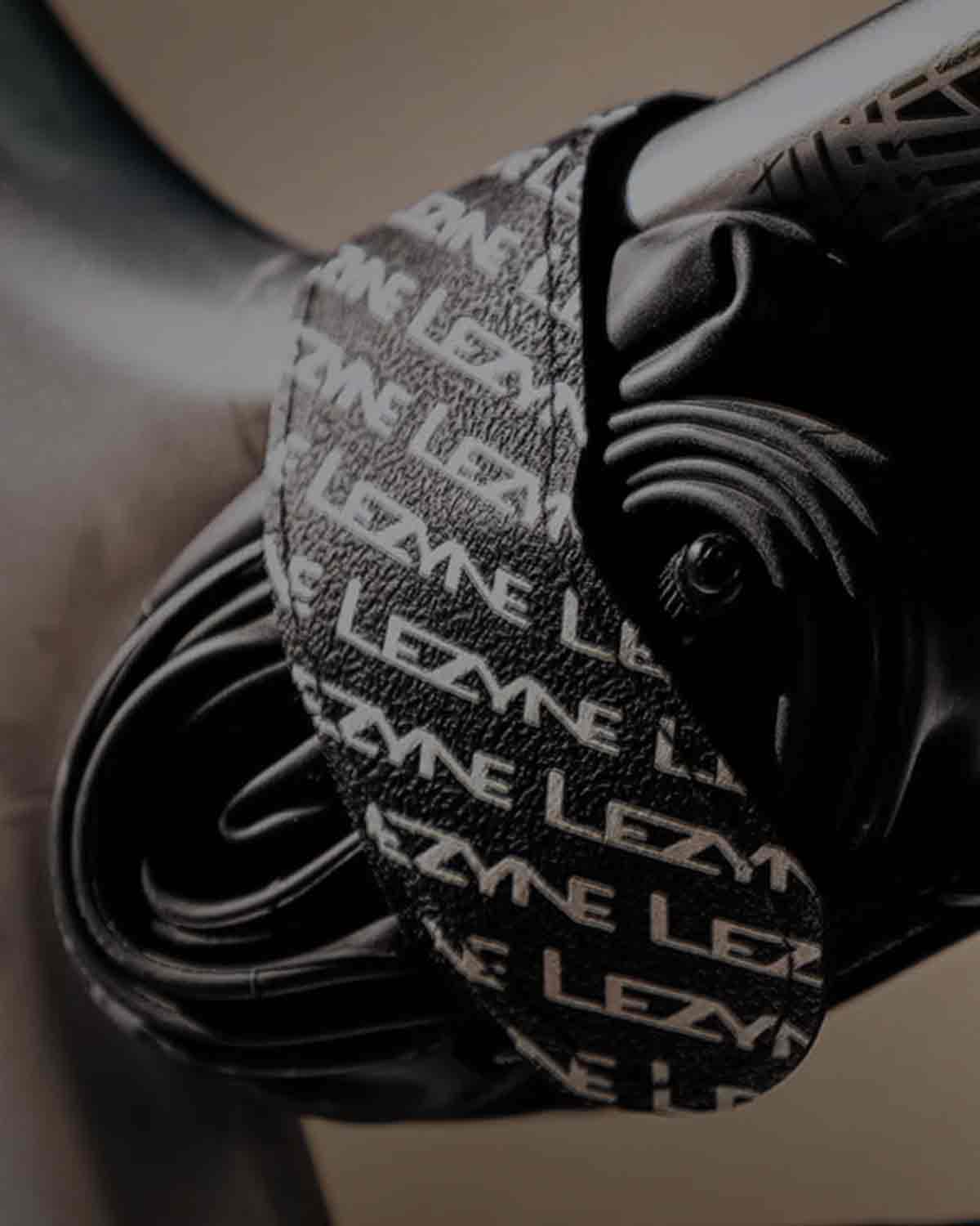 A bicycle tire tube mounted to a bicycle frame with a strap.