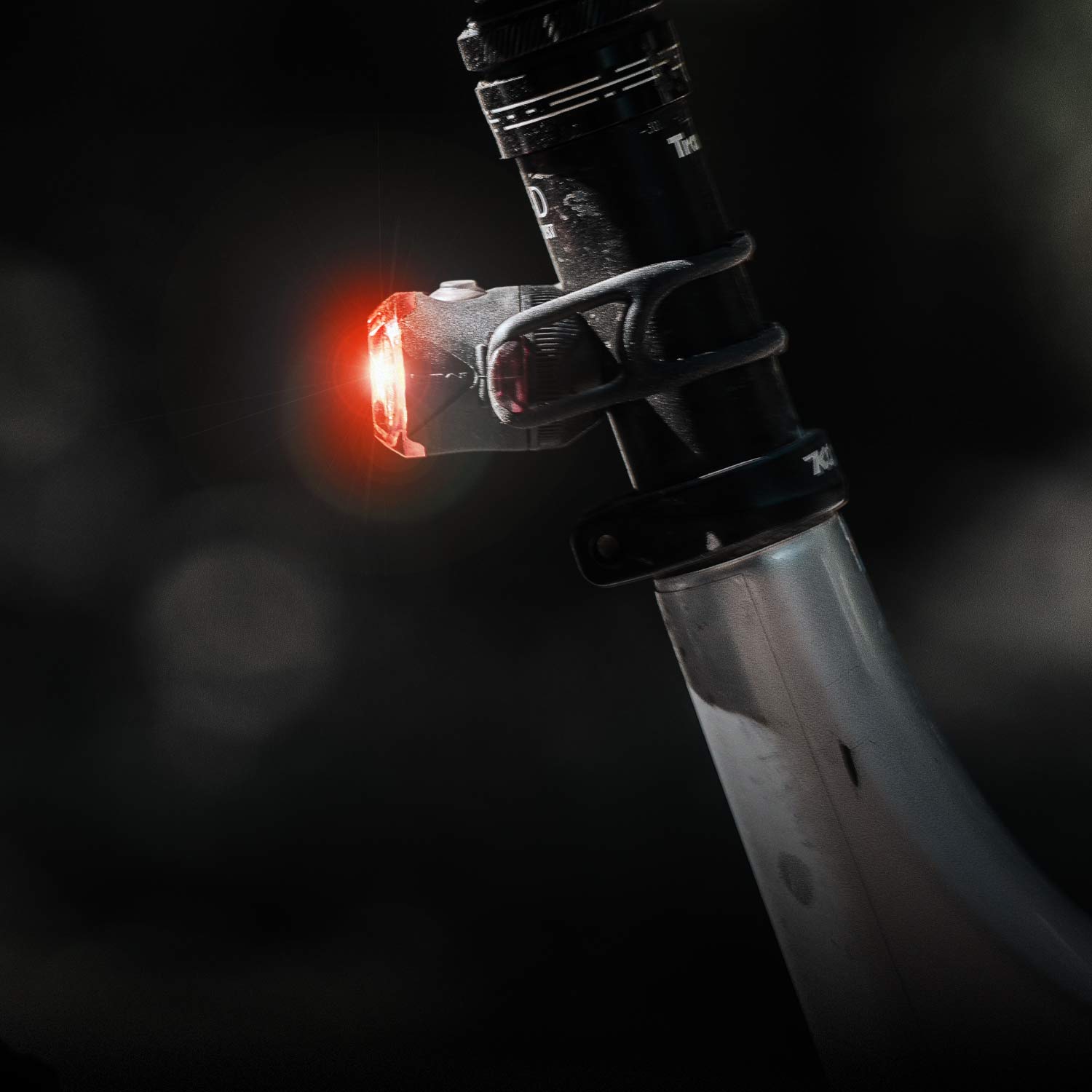 A small bright light mounted to a seat post.