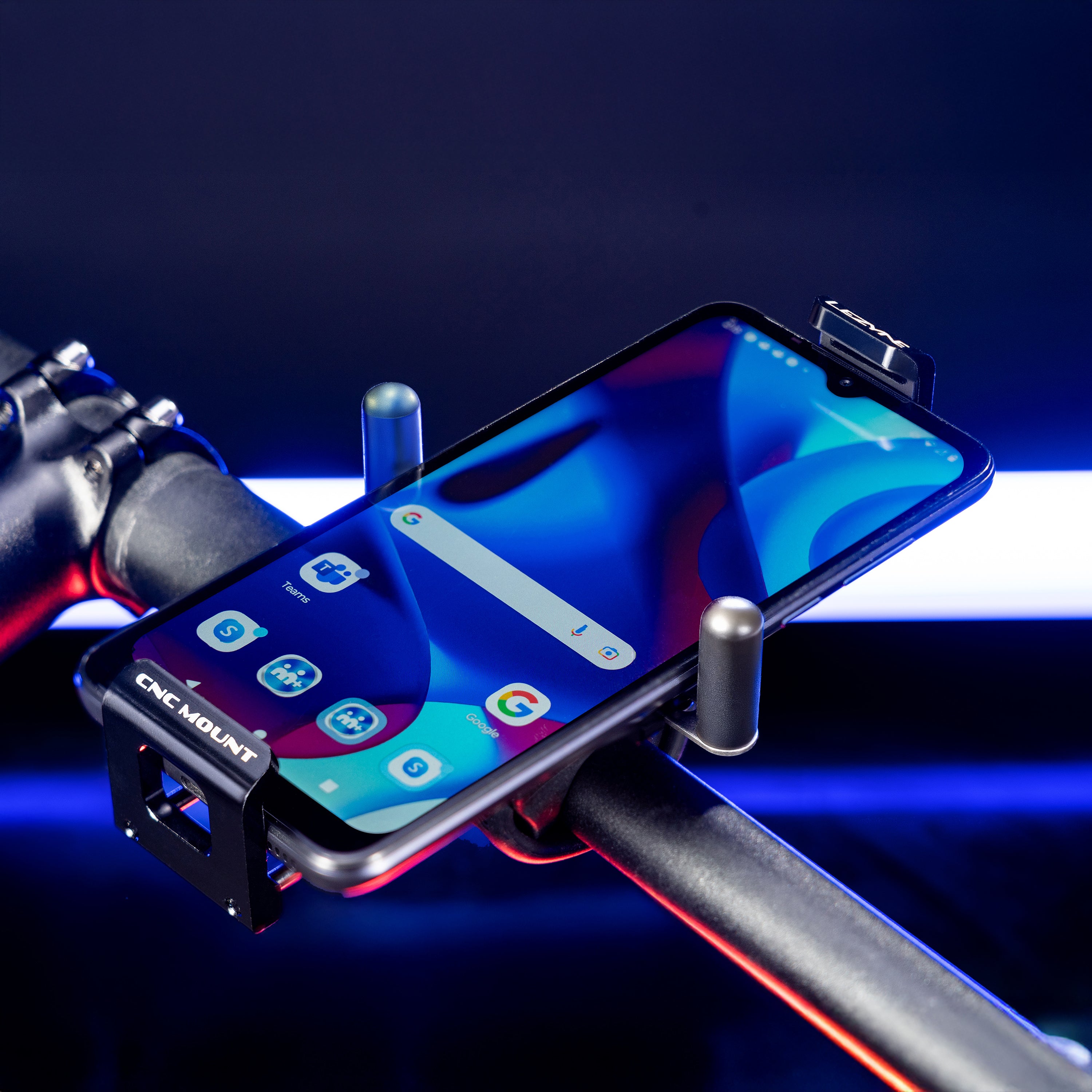 Adjustable side arms of CNC Phone Mount holding a large smartphone firmly in place.