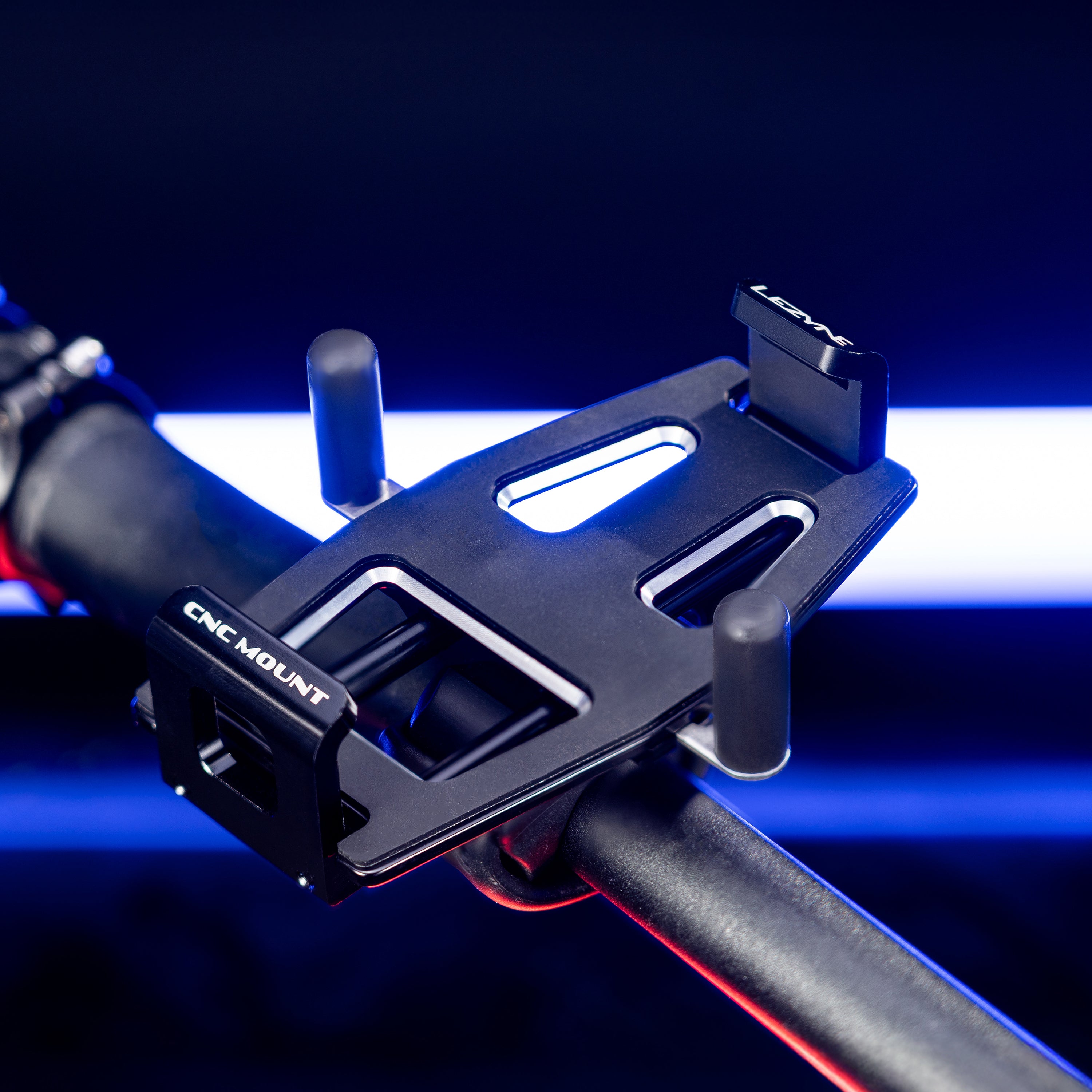 CNC Phone Mount with non-slip contact points to protect phone and prevent movement on bumpy terrain.