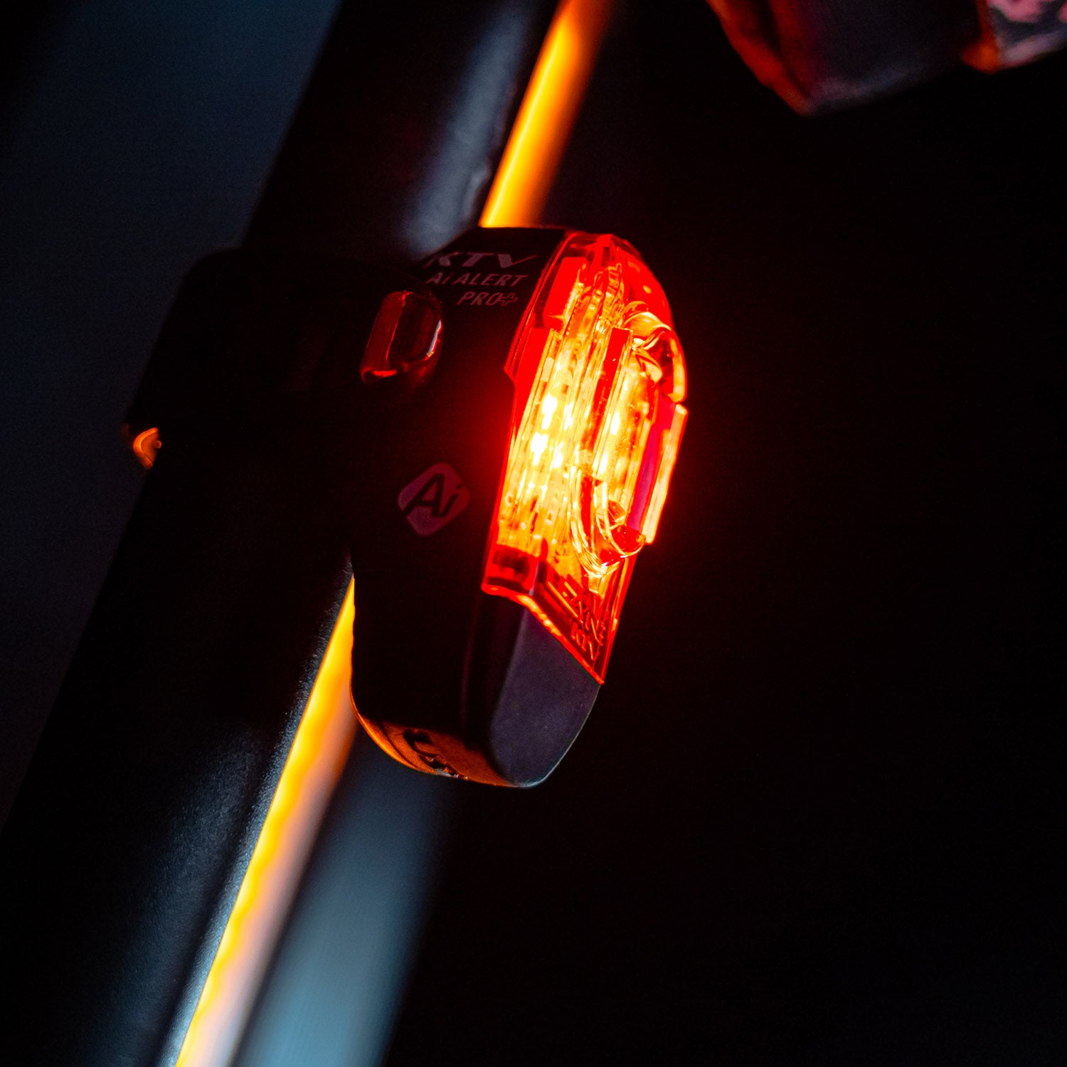 Lezyne KTV Pro+ Ai Alert LED rear bike light mounted on seat stem of a commuter bike.