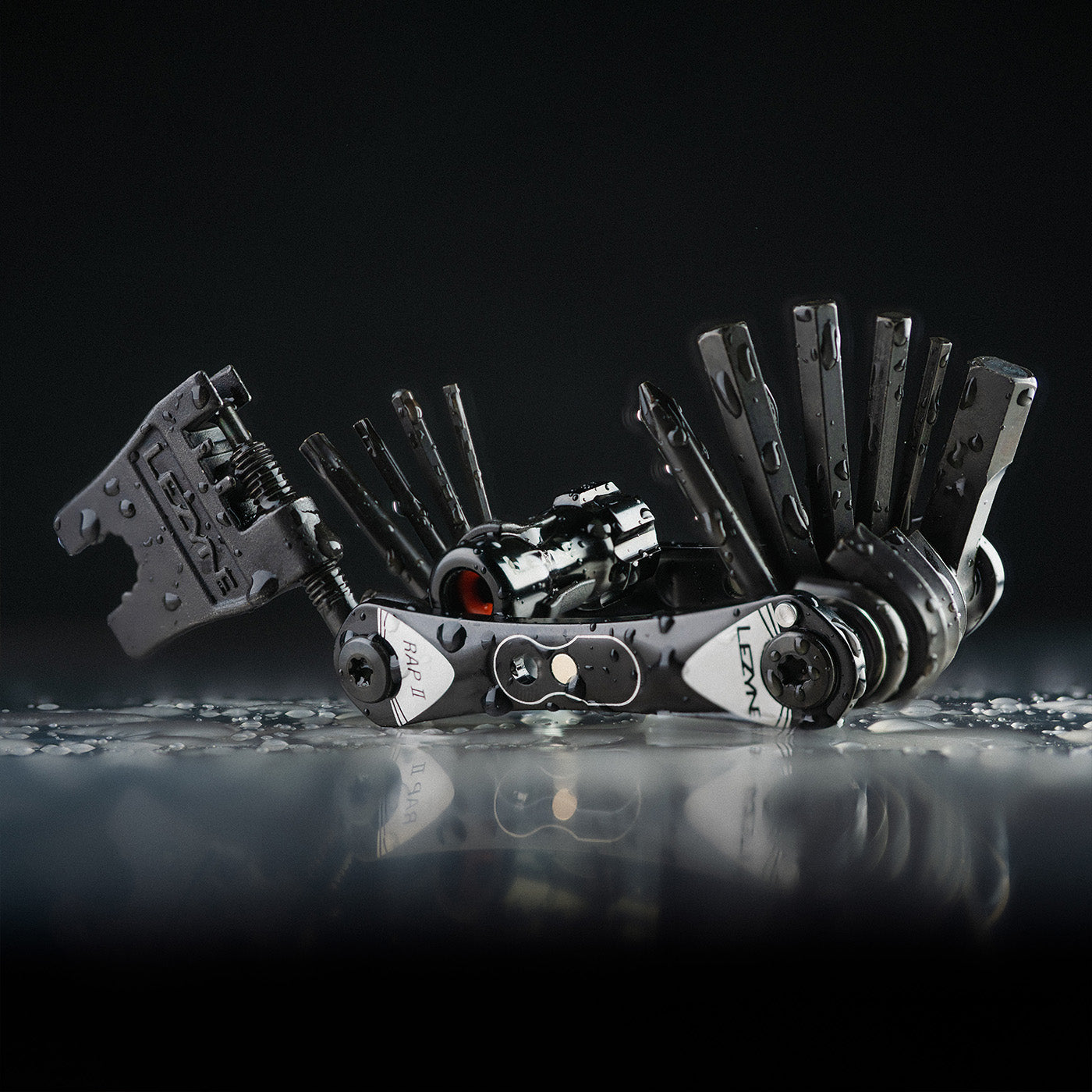 A fold out multi tool with the word Lezyne printed on the side.