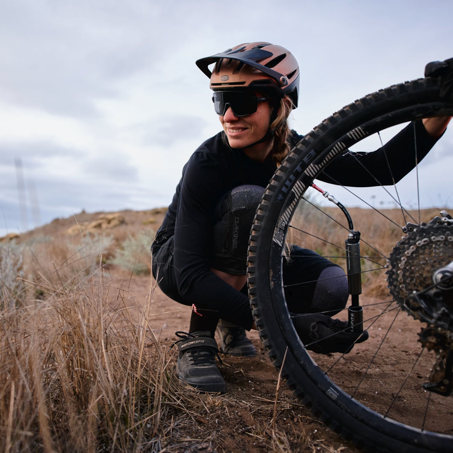 Lezyne Pocket Drive HV. Compact high volume hand pump in use, pumping up Mountain bike tire.