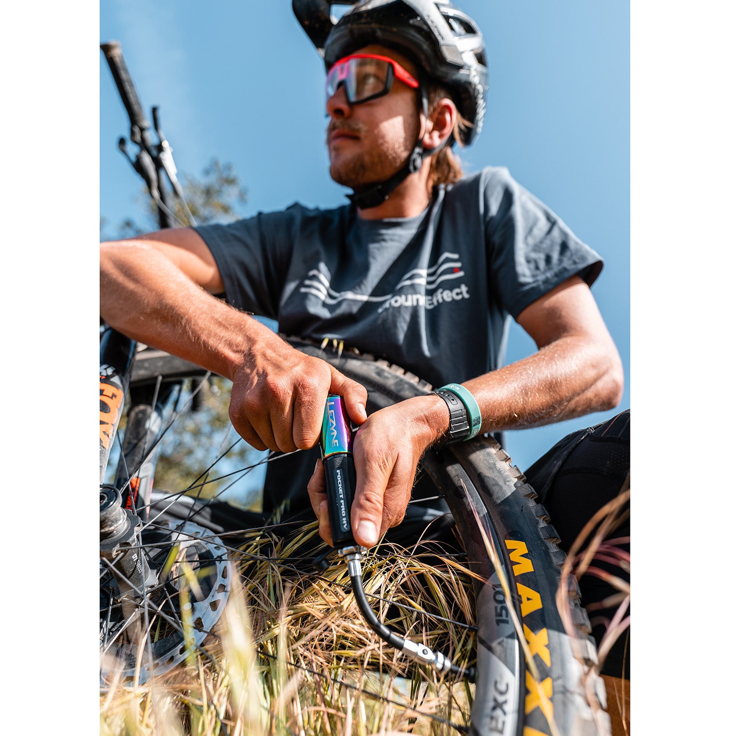 Pocket Drive Pro HV in action on a gravel ride, demonstrating high-volume inflation efficiency in outdoor use.