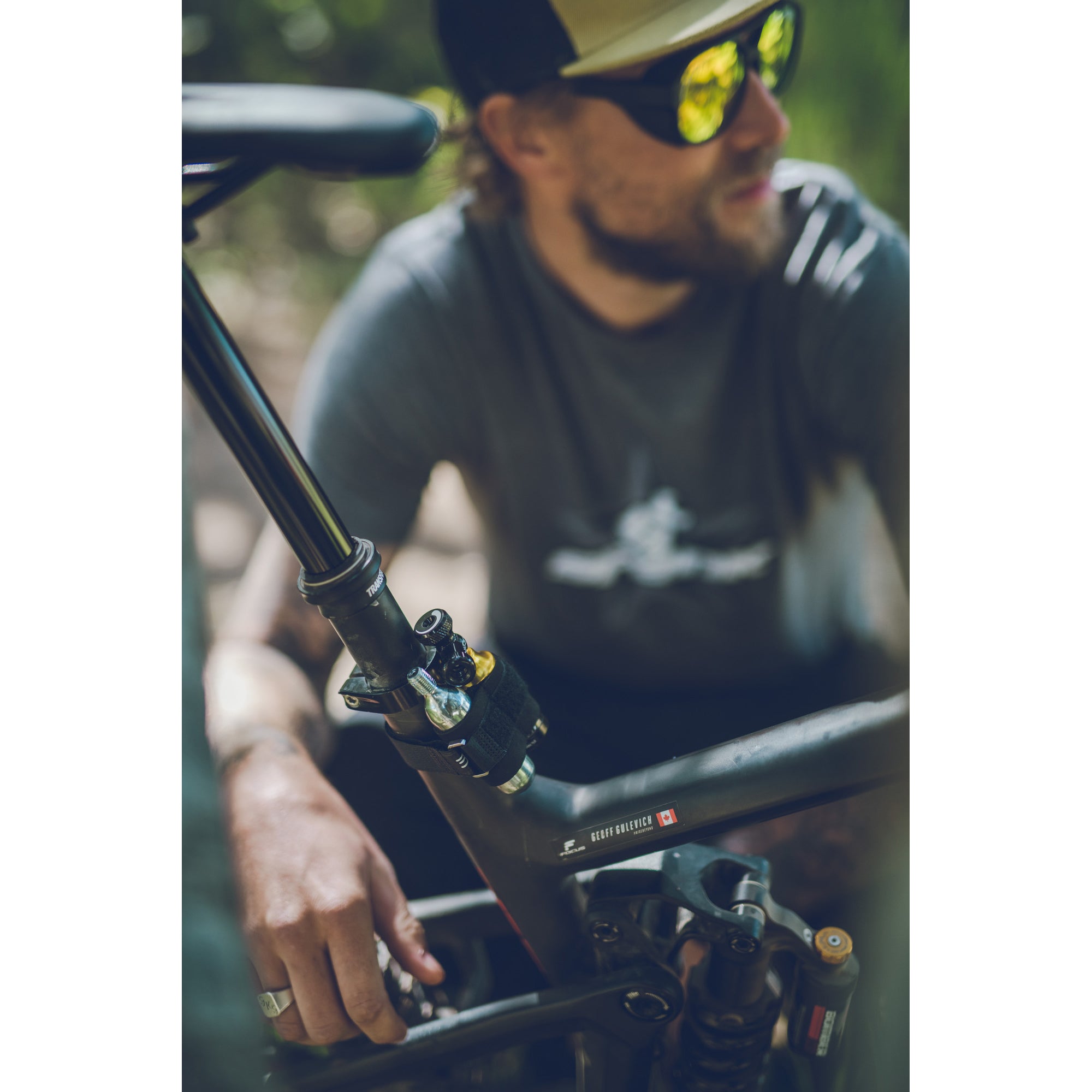 Lezyne Tubeless CO2 Blaster securely mounted to bike frame with included strap, ready for on-the-go repairs.