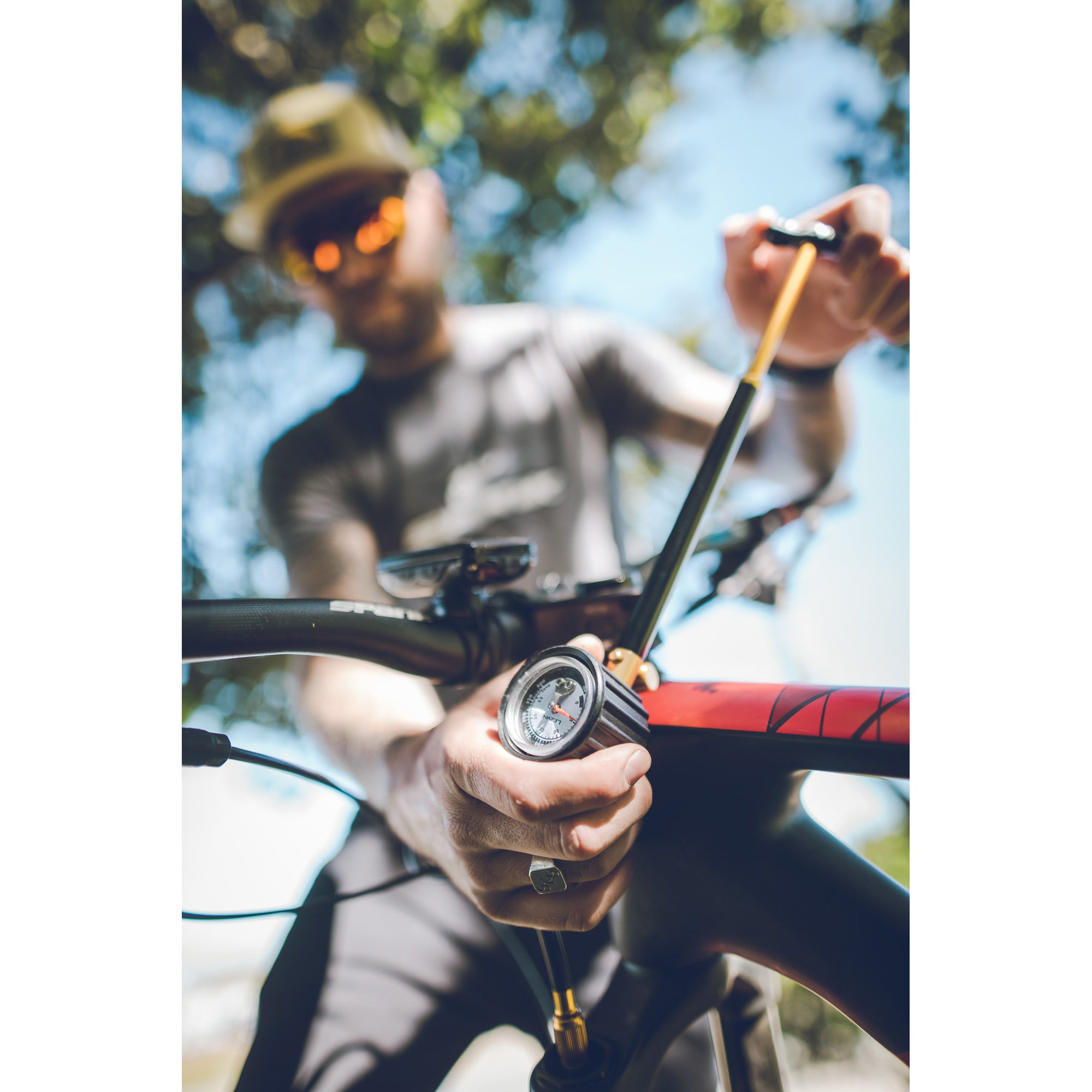 Compact Shock Drive mountain bike shock pump with ergonomic design and accurate diaphragm gauge for high-pressure inflation.