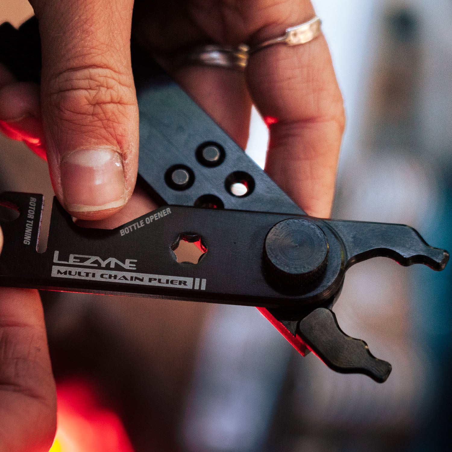 Compact and lightweight Lezyne Multi Chain Pliers with integrated bottle opener and quick-link tool for road and trail use.