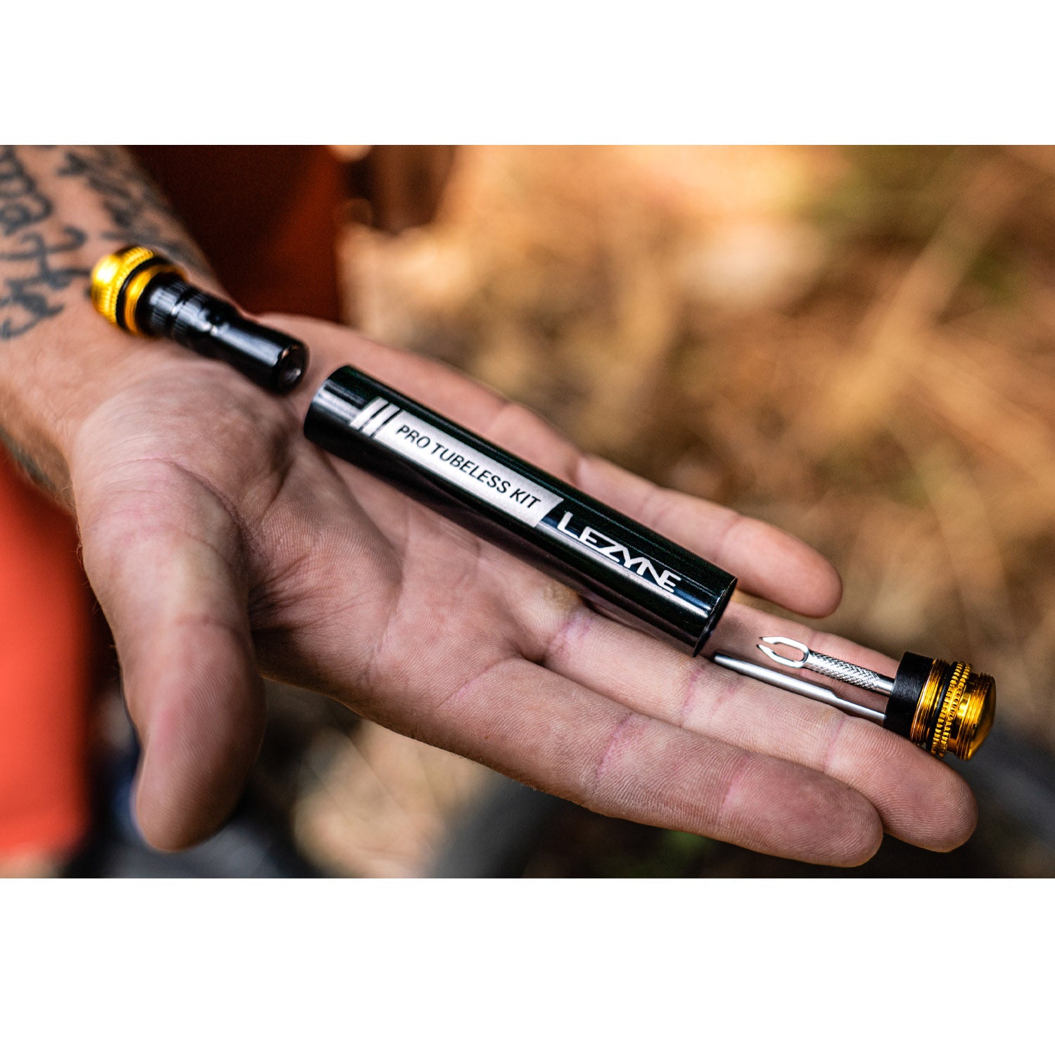 Close-up of the compact Pro Tubeless Kit, featuring a stainless steel plug insertion tool.