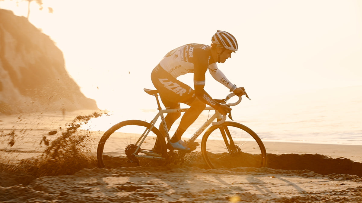 cycling ride bike through sand on beach