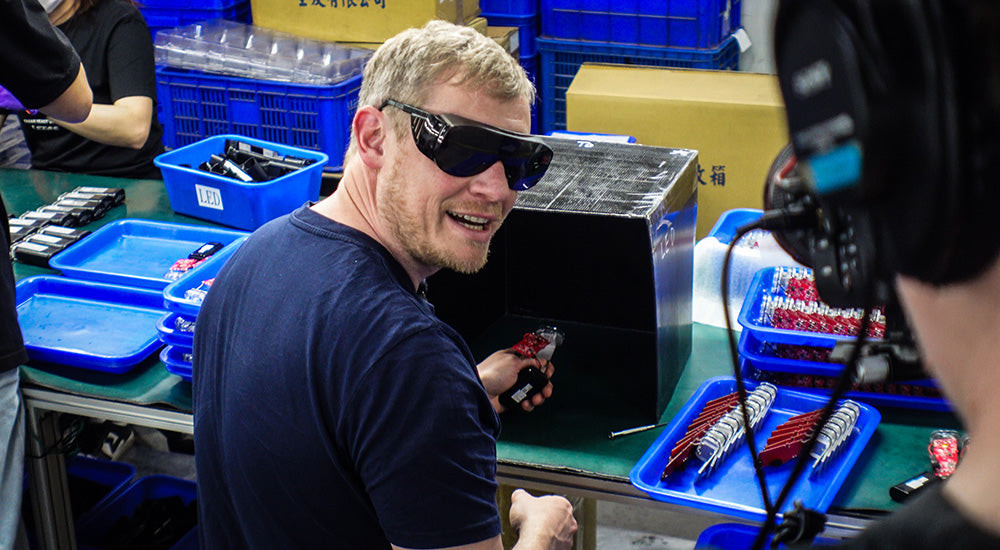 Tom from MBUK inside Lezyne factory in Taiwan building Macro Drive 1400 MTB light, showcasing CNC machining, assembly, and quality control processes.