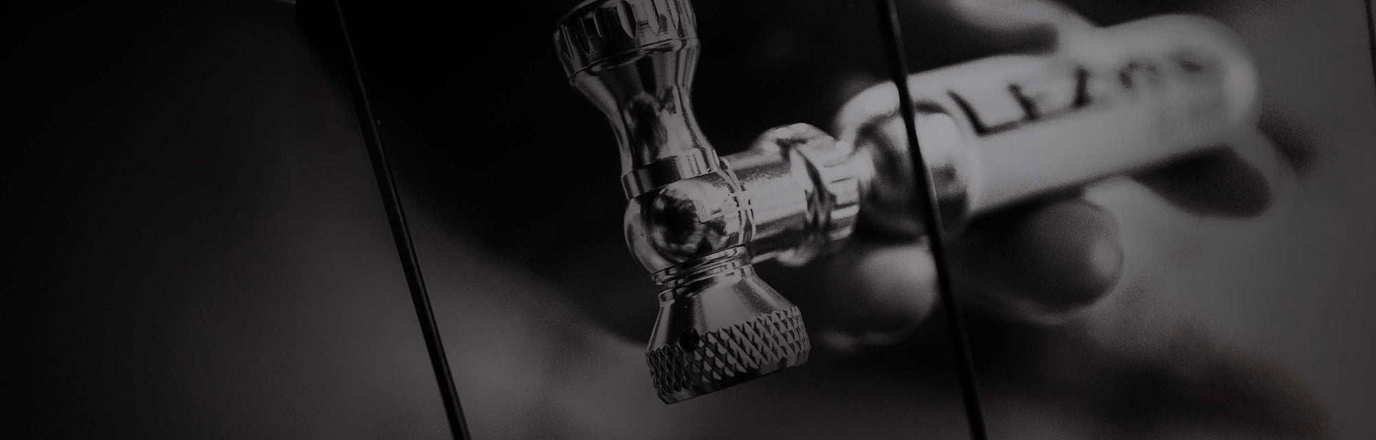 A CO2 tire inflation canister near some bicycle tire spokes.