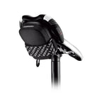 Compact Lezyne Road Caddy saddle bag featuring a water-resistant zipper and reflective accents for enhanced nighttime visibility.