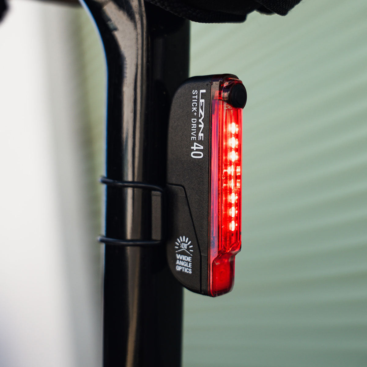STICK+ DRIVE LED rear bike light mounted on seatpost, bright beam, high visibility for road, gravel & commuter cyclists.