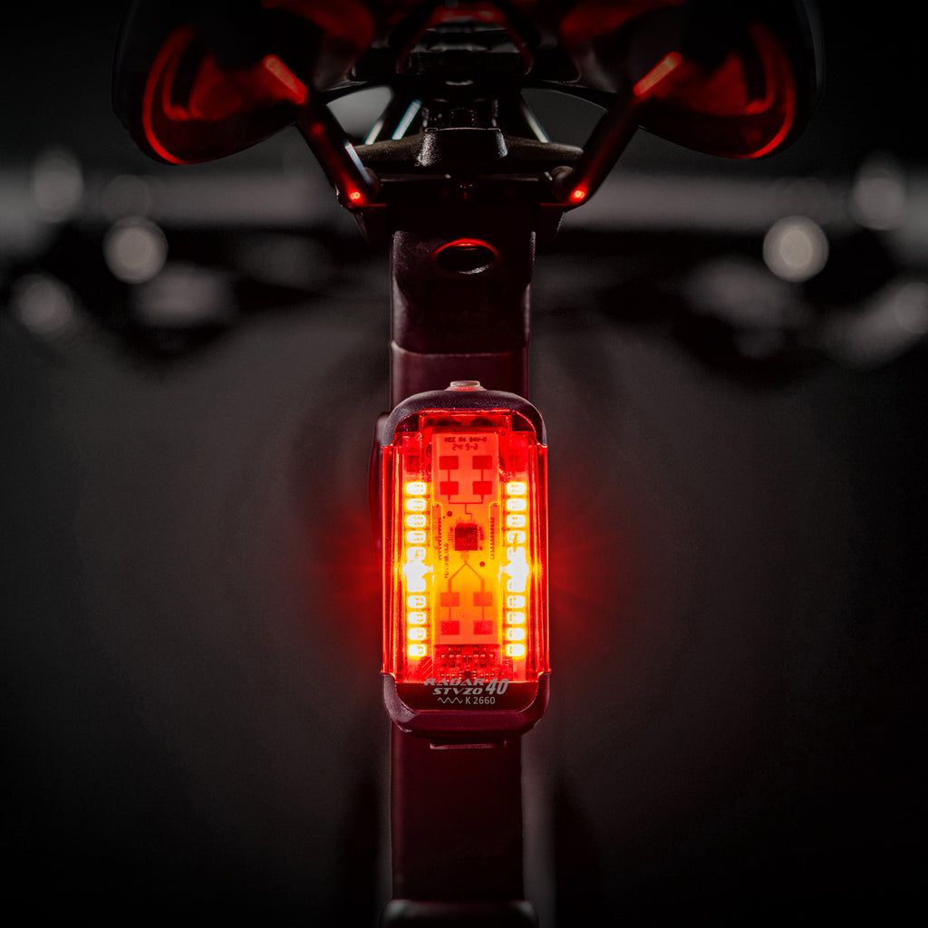Lezyne Radar StVZO Rear glowing brightly on a road bike, providing radar-based vehicle alerts for safety.