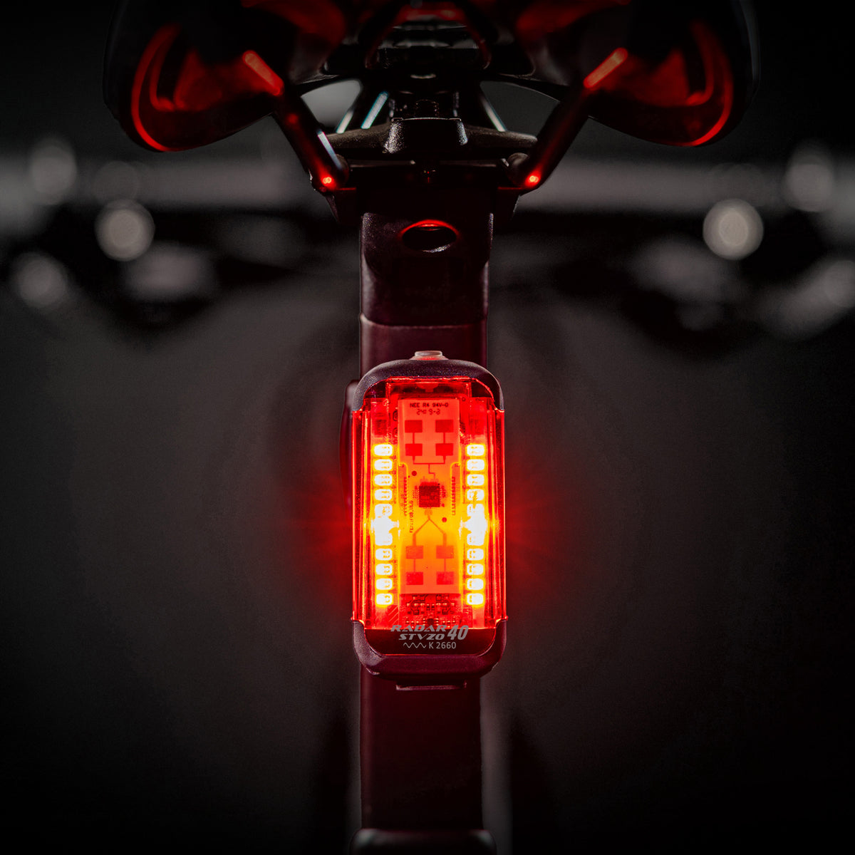 Lezyne Radar StVZO Rear glowing brightly on a road bike, providing radar-based vehicle alerts for safety.