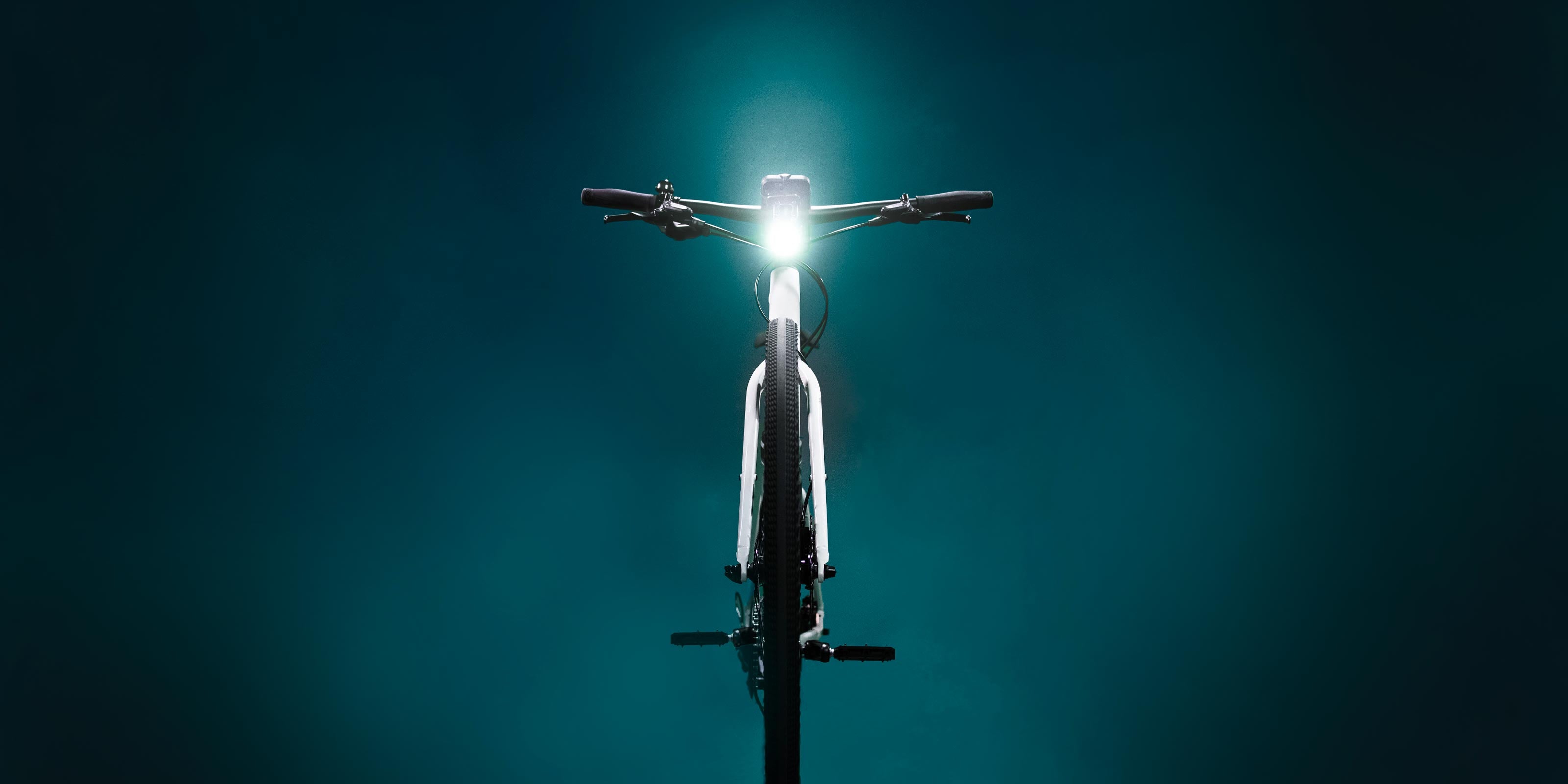 Front bike light on a bike on green background